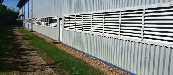 White Painted Aluminium Fixed Blade Natural Ventilation Louvres installed into a factory building in Yorkshire