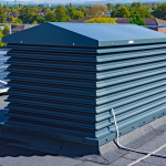 Our A Series grey painted natural ventilation louvred turret in-situ on a roof in Manchester